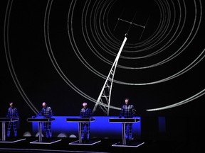 In this November 6, 2014 file photo, German band Kraftwerk performs live at the Louis Vuitton Art Foundation in Paris.  AFP PHOTO/DOMINIQUE FAGET/FILES