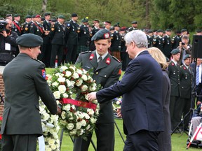 Stephen Harper and his wife Laureen attended the 70th anniversary remembrance ceremony at the Canadian War Cemetery in Holten, Netherlands Monday May, 4, 2015. Harper spoke about the strong bond between Canada and Holland while standing among the graves of nearly 1,400 soldiers, mostly Canadians who died during the liberation.  Erica Bajer/St. Catharines Standard/Postmedia Network