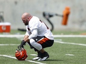 Andrew Whitworth of the Cincinnati Bengals takes a break during an organized team activity workout. (Joe Robbins/AFP)
