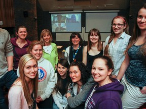 The 13 nursing students, along with two professors, in the international cross culture nursing elective course pose for a photo in a lecture hall at St. Lawrence College, Kingston campus on Friday May 1, 2015. The group will be heading to Moshi ,Tanzania on May 6 for three weeks to work in a women's clinic and learn about medicine and communication while working with other cultures. Julia McKay/The Kingston Whig-Standard/Postmedia Network