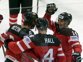 Taylor Hall celebrates his goal against the Czech Republic with teammates Jake Muzzin and Jordan Eberle during their Ice Hockey World Championship game Monday. (David Cerny, Reuters)