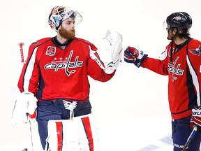 Washington Capitals goalie Braden Holtby (left) and winger Tom Wilson celebrate after their win over the New York Rangers in Game 2 of their second-round playoff series Monday at the Verizon Center. (Geoff Burke/USA TODAY Sports)