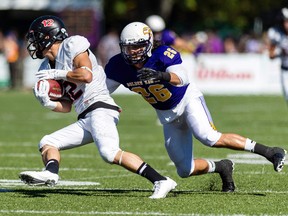 Anthony Petrucci, right, is one of three Sarnia natives heading to the 2015 East West Bowl in Montreal, starting Tuesday. Petrucci, 21, plays a mix between defensive back and linebacker for the Laurier Golden Hawks. (Handout photo)