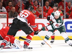 Minnesota Wild centre Mikael Granlund (64) scores a goal past Chicago Blackhawks defenceman Michal Rozsival (32) and goalie Corey Crawford (50) during the second period in game one of the second round of the 2015 Stanley Cup Playoffs at United Center. (Jerry Lai-USA TODAY Sports)