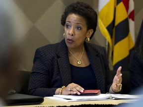 Attorney General Loretta Lynch speaks with congressmen and faith leaders after meeting in private with Freddie Gray's family at Baltimore University in Baltimore, Maryland, May 5, 2015. The new Attorney General and the head of the Justice Department's civil rights division travelled to Baltimore on Tuesday, the week after the city's top prosecutor charged six police officers in the death of a black man.     REUTERS/Jose Luis Magana/Pool