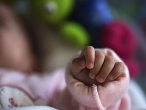newborn baby's hand baby filer