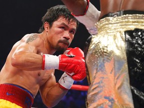 Manny Pacquiao keeps his eyes on Floyd Mayweather Jr. during the third round of their welterweight title fight in Las Vegas May 2, 2015. (REUTERS/Steve Marcus)