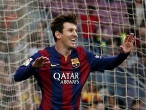 Barcelona’s Lionel Messi celebrates his goal against Getafe during their Spanish first division match at Nou Camp stadium in Barcelona April 28, 2015. (REUTERS/Gustau Nacarino)