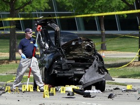 Members of the FBI Evidence Response Team investigate the crime scene outside of the Curtis Culwell Center after a shooting occurred the day before, on May 04, 2015 in Garland, Texas. During the "Muhammad Art Exhibit and Cartoon Contest," on May 03, Elton Simpson of Phoenix, Arizonia and Nadir Soofi opened fire, wounding a security guard. (AFP)