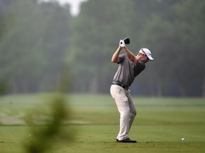 David Hearn of Canada tees off on the 12th hole during a continuation of round three of the Zurich Classic of New Orleans at TPC Louisiana on April 26, 2015 in Avondale, Louisiana. (Stacy Revere/Getty Images/AFP)