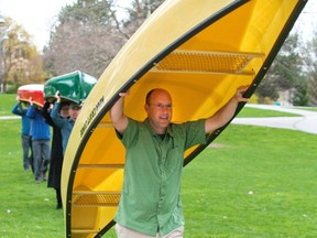 Mayor Matt Brown leads portagers through Ivey Park on the way to announcing a contest to redesign the Forks of the Thames Tuesday. (DEREK RUTTAN, The London Free Press)