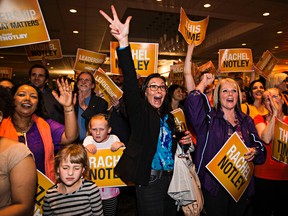 NDP supporters cheer after an NDP majority government is declared at the NDP election headquarters at the Westin Hotel in Edmonton, Alta. on Tuesday, May 5, 2015. Codie McLachlan/Edmonton Sun/Postmedia Network