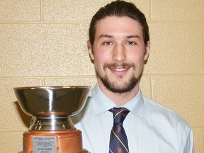 Queen's Golden Gaels MVP men's varsity hockey netminder Kevin Bailie, the 2014 CIS Rookie of the Year, holds his Robinson-Kelleher Memorial Award keeper trophy as Belleville's Athlete of the Year for 2014 at the annual Honours and Awards Night Tuesday at the QSC. (Paul Svoboda/THe Intelligencer)