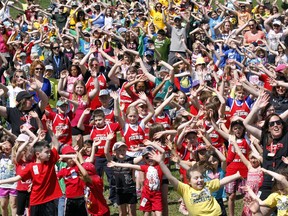 More than 3,000 students from more than 20 schools with the Hastings and Prince Edward District School Board and Algonquin and Lakeshore Catholic District School Board are warming up, ready to dance in unison, dressed in their school colours during the 25th Celebration of Dance at the Fairgrounds in Belleville, Ont. Wednesday, May 6, 2015.  -  Jerome Lessard/Belleville Intelligencer/Postmedia Network