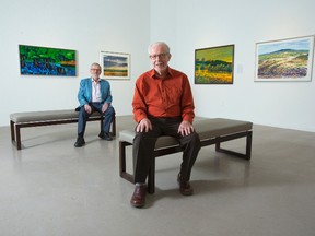 Maurice Stubbs, front, and his cousin Henry Stubbs sit in the McIntosh Gallery were Maurice?s work is on display. The 90-year-old painter was the McIntosh Gallery?s curator for 20 years. A book about his life and work, Maurice Stubbs Intuitive Painter, recently has been published.