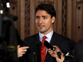 Liberal Leader Justin Trudeau talks to reporters after the federal budget was delivered on Parliament Hill in Ottawa April 21, 2015. (REUTERS/Patrick Doyle)