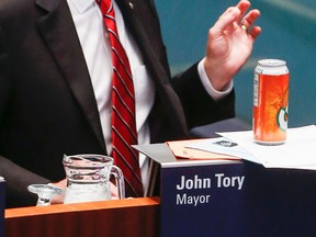 Mayor John Tory got a cold can of Orange Crush left on his desk and he laughed off the “gift” from his happy council colleagues Wednesday, May 6, 2015 after the NDP win in Alberta. (Dave Thomas/Toronto Sun)