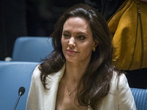 Actress Angelina Jolie, United Nations High Commissioner for Refugees (UNHCR) special envoy, winks as she arrives to speak during a United Nations Security Council meeting regarding the refugee crisis in Syria at the United Nations Headquarters in New York April 24, 2015. (REUTERS/Lucas Jackson)