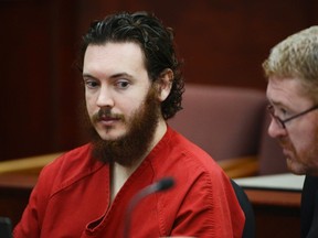 James Holmes and his defense attorney Daniel King (R) sit in court for an advisement hearing at the Arapahoe County Justice Center in Centennial, Colorado in this photo taken June 4, 2013. REUTERS/Andy Cross/Pool