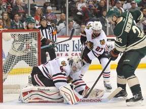 Minnesota Wild forward Nino Niederreiter looks for a rebound after Chicago Blackhawks goalie Corey Crawford makes a save during the second period of Game 3 of their series on Tuesday night. (USA TODAY Sports)