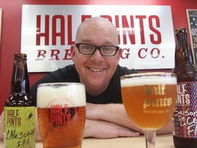 David Rudge, president and brewmanster at Half Pints Brewery, displays some of his products. Rudge is happy that the government will be allowing tasting rooms in small breweries.