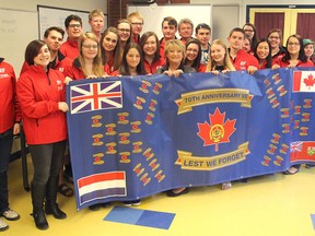 Students and staff from Napanee District Secondary School who are currently on a VE Day tour of Europe pose prior to their departure with the flag they have taken with them. They were to visit a Canadian war cemetery in Holland as well as Auschwitz concentration camp.(Michael Lea/The Whig-Standard)
