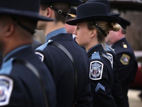 Members of the Maryland Anne Arundel County Police participate in a news conference March 24, 2015 on Capitol Hill in Washington, DC. A group of bipartisan lawmakers held the news conference urging to create a national alert system "to apprehend violent criminals who have injured or killed police officers."  (Alex Wong/AFP)