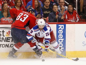 New York Rangers winger Martin St. Louis (26) and Washington Capitals centre Jay Beagle (83) battle for the puck during Game 4 of the second round of the 2015 Stanley Cup playoffs Wednesday at Verizon Center. (Geoff Burke/USA TODAY Sports)