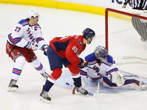 Washington Capitals winger Andre Burakovsky (65) scores on New York Rangers goalie Henrik Lundqvist as defenceman Ryan McDonagh defends during Game 4 of their playoff series Wednesday at the Verizon Center. (Geoff Burke/USA TODAY Sports)