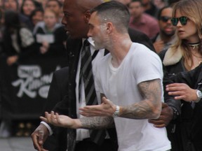 Adam Levine appears outside the Jimmy Kimmel Live! studios after having a bag of sugar dumped on him. (WENN.COM photo)