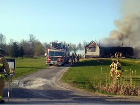 Fire crews battle a house blaze at 7701 Fairhurst Dr., in the city's rural southwest, near North Gower, on Wednesday night. (Todd Horricks Ottawa Fire Service photo)