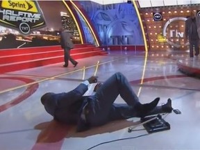 Shaquille O'Neal takes a hard fall during the live halftime show of "NBA on TNT" on Wednesday night. (YouTube/screen grab)