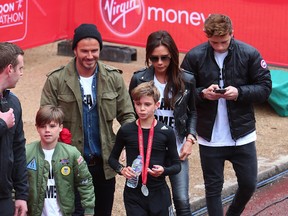 David Beckham, Victoria Beckham and their sons, Brooklyn, Romeo and Cruz. (WENN.COM)