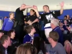 Tampa Bay Lightning fan Lucas Cassidy is apprehended by security in this video posted to 10 News' website. (Screen grab)