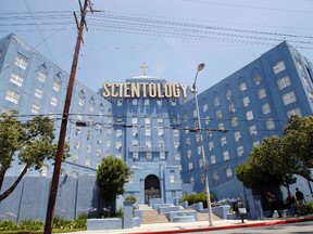 People walk past the Church of Scientology of Los Angeles building in Los Angeles, California July 3, 2012.  REUTERS/Mario Anzuoni