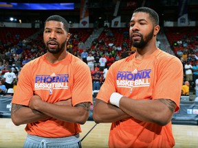 Brothers Marcus and Markieff Morris of the Phoenix Suns pleaded not guilty to aggravated assault charges. (Garrett W. Ellwood/NBAE via Getty Images/AFP)