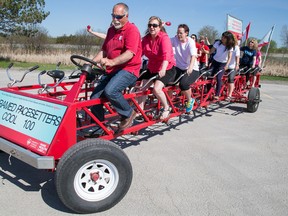 TIM MILLER/THE INTELLIGENCER
Two half-teams consisting of Cool 100 and Paramed staff ride the Big Bike for the Heart and Stroke Foundation in Belleville on Thursday. Each rider has committed to raise $50 or more to support heart disease and stroke research.