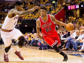 Jimmy Butler of the Chicago Bulls drives against Iman Shumpert of the Cleveland Cavaliers in the second half during Game One in the Eastern Conference Semifinals of the 2015 NBA Playoffs. The Bulls defeated the Cavaliers 99-92. (Jason Miller/AFP)