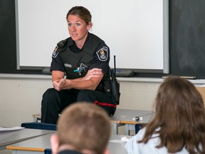 TIM MILLER/ THE INTELLIGENCER
Const. Terri Smith, a community resource officer with Belleville Police Services, speaks to a group of students at St. Theresa Catholic Secondary School in Belleville on Thursday as part of the school’s Career Day.