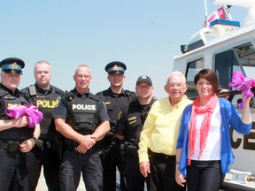 The 2015 Purple Ribbon Campaign is underway locally through the Lambton Drug Awareness Action Committee (LDAAC) and its partners, the Bluewater Anglers and the Bluewater Lions Club of Sarnia. From left are OPP Sgt. Tim Ives, OPP Const. Chris Milligan, Sarnia Police Const. Chris Moxley, OPP Const. Chris Doupe, OPP Const. Carlos Teixeira, LDAAC president and Lions Club member Art Speed, and Lambton Public Health promoter Lisa Clark.  (Terry Bridge/Sarnia Observer/Postmedia Network)