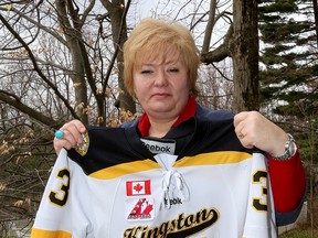 Kim Sebrango, suspended as president of the Greater Kingston Minor Hockey Association, holds her son's hockey jersey at her home in Kingston.
(Ian MacAlpine/The Whig-Standard)