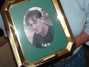 Theresa McCuaig looks at a photo of her grandson Sylvain Leduc, who was brutally murdered in 1995. Nov. 23, 2010. KELLY ROCHE/Ottawa Sun