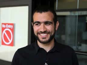 Omar Khadr smiles outside the Edmonton Law Courts Buildings on Thursday May 7, 2015 after Alberta's highest court released the former Guantanamo Bay detainee on bail pending the appeal of his convictions in the United States. (Tom Braid/Postmedia Network)