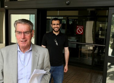 Lawyer Denis Edney and Omar Khadr smilie as they walk outside the Edmonton Law Courts Buildings on Thursday afternoon on May 7, 2015 after Alberta's highest court released the former Guantanamo Bay detainee on bail Thursday pending the appeal of his convictions in the United States.  Tom Braid/Edmonton Sun/QMI Agency
