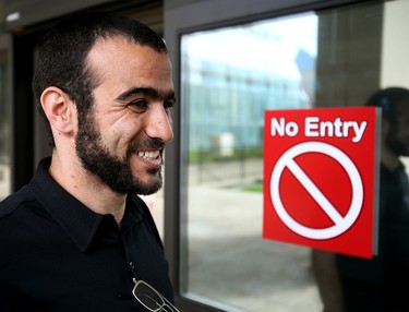 Omar Khadr smilies outside the Edmonton Law Courts Buildings on Thursday afternoon on May 7, 2015 after Alberta's highest court released the former Guantanamo Bay detainee on bail pending the appeal of his convictions in the United States. Tom Braid/Edmonton Sun/QMI Agency