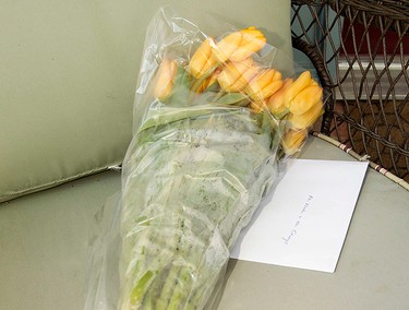 Flowers and welcome card dropped off by a neighbour sit outside the west Edmonton home where Omar Khadr will be staying with his lawyer Dennis Edney, in Edmonton, Alta. on Thursday May 7, 2015. David Bloom/Edmonton Sun/Postmedia Network