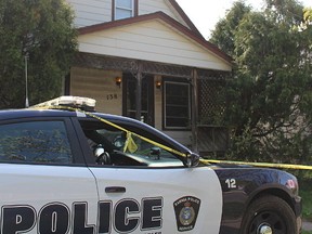 Sarnia police and the regional coroner's office are investigating a death after a body was found at this address at the corner of Russell and Cobden streets Wednesday.(Tyler Kula/Sarnia Observer/Postmedia Network)