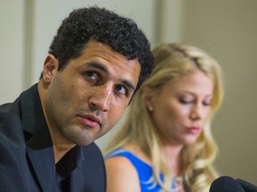 Canadian hockey player Andre Deveaux, along with his wife Anya Nordstrom, talk during a press conference at the Sheraton Hotel in Toronto on May 8, 2015. (Ernest Doroszuk/Toronto Sun/Postmedia Network)
