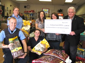 Members of the Kent Branch of the OSPCA were thrilled to receive more than $2,000 worth of pet food and supplies on May 8 The money was raised by John Cryderman, who challenged the Cats and Dogs Smart Pet Food store to match his $1,000 donation. Back row, from left: Nicole Cassel; Joanne Bondy, store owner; Robyn Brady and John Cryderman. Front: Ryan Sparks and Amber Ogle. (Blair Andrews/Chatham This Week)