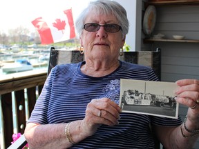 Point Edward resident Fern Tice shows a photo of her mother Beatrice Telfer and fellow local Red Cross women on Thursday May 7, 2015 in Point Edward, Ont. Her mother and her friends are pictured in the photo participating in Sarnia's VE Day parade May 8, 1945. (Barbara Simpson/Sarnia Observer/Postmedia Network)